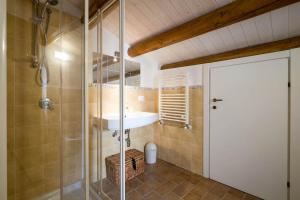 a bathroom with a sink and a shower at Penthouse Luxury Quattro Canti in Palermo