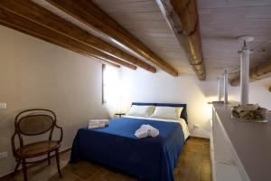 Giường trong phòng chung tại Penthouse Luxury Quattro Canti