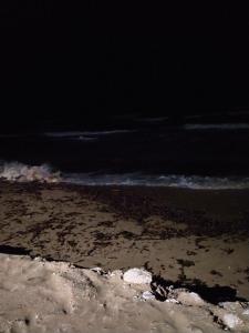 a view of the beach at night with the ocean at Villa mendola in Cianciana