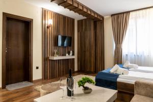 A bed or beds in a room at Beluga Guest House