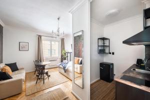 a living room with a couch and a table at Crystal Apartment in Prague