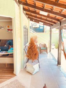 a porch with a potted plant on a patio at Pousada Mar de Almirante in Penha +63 photos