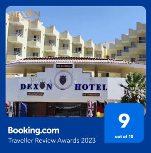 um hotel com uma placa em frente em Dexon Roma Hotel em Hurghada