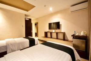 Postel nebo postele na pokoji v ubytování ECL Resort Hotel Boracay
