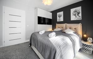 Ένα ή περισσότερα κρεβάτια σε δωμάτιο στο Apartament AP8