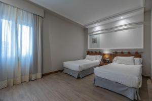 Postel nebo postele na pokoji v ubytování Hotel Olid + 37 fotografií