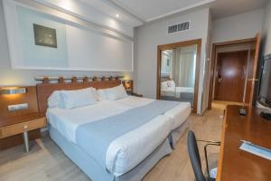 Postel nebo postele na pokoji v ubytování Hotel Olid