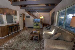 a living room with a couch and a table at Cozy Cabin home in South Lake Tahoe