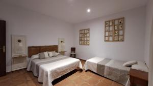 A bed or beds in a room at Mirador del Sotillo