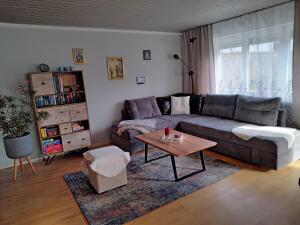 a living room with a couch and a coffee table at ciao-aschau FeWo Lexa in Aschau