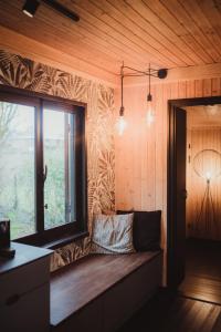 a room with a couch and a window in a room at Ô NaNo Glamping in Dalhem