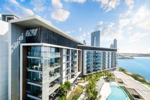 an image of a building with a view of the ocean at LUX - The Bluewater Island Suite in Dubai