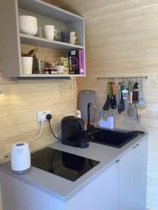 a kitchen with a sink and a counter top at SkyFall in Woodbridge