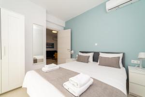 Letto o letti in una camera di Danai & Palm Residential Complexes