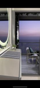 a view of a balcony with a view of the ocean at برج داماك الجوهرة جدة - Damac al jawharah tower in Jeddah