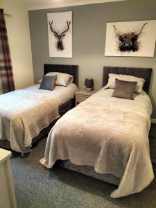 Postel nebo postele na pokoji v ubytování Seaview cosy 2 bed home in Lamlash - 'Mid Drive'