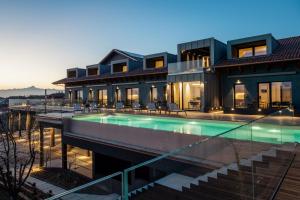 an image of a house with a swimming pool at VINEHO in Barolo