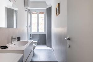 a bathroom with a sink and a toilet and a shower at HospitalityRome Casa Veronica in Rome