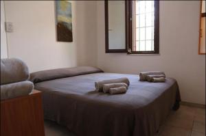 レイタニにあるVille Vendicari al mareのベッド1台(枕2つ付)が備わる客室です。