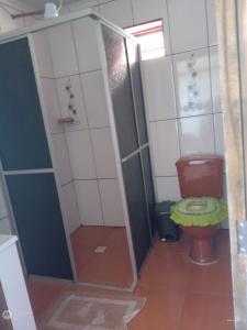 a bathroom with a shower and a toilet at Apart Hotel Esperança in Ametista do Sul