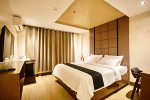 Postel nebo postele na pokoji v ubytování ECL Resort Hotel Boracay