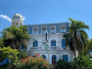 a building with a clock tower on top of it at Hotel Vicente López in Vicente López