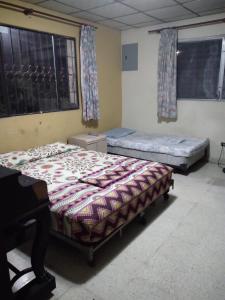 Un ou plusieurs lits dans un hébergement de l'établissement PaCasa Hostel