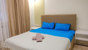 Postel nebo postele na pokoji v ubytování Apple Hostel Bishkek