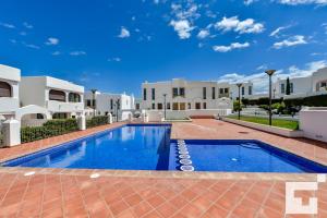 a swimming pool in front of a building at Villa Mirador de Bassetes 14 - Grupo Turis in Calpe