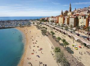 an aerial view of a beach with people on it at Studio DolceCasa Menton in Menton