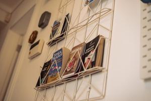 a group of signs hanging on a wall at Breathe In in Zambujeira do Mar