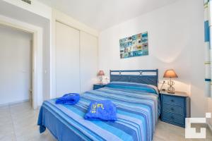 Łóżko lub łóżka w pokoju w obiekcie Apartamento Rubino 5C - Grupo Turis