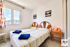 Łóżko lub łóżka w pokoju w obiekcie Apartamento Rubino 5C - Grupo Turis