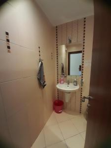 a small bathroom with a sink and a toilet at Green Life Beach Resort Private Studio Flat First Line Kavatsi Smokinya Beach Sozopol in Sozopol