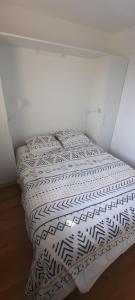 a bedroom with two beds in a room at Au pied des dunes in Seignosse