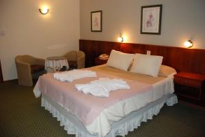 Ένα ή περισσότερα κρεβάτια σε δωμάτιο στο Hotel La Posta +8 φωτογραφίες