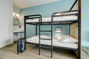 Postel nebo postele na pokoji v ubytování MEININGER Venezia Mestre