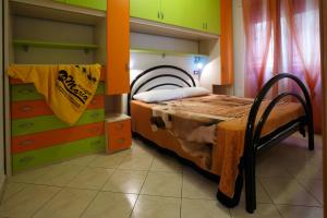 A bed or beds in a room at Palazzina Elvira