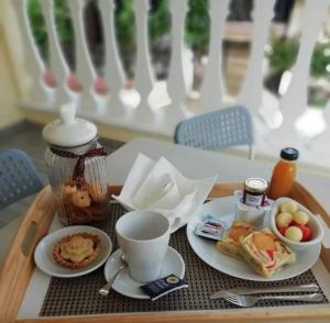 a tray of breakfast food on a table at DolceSosta B&B in Pulsano