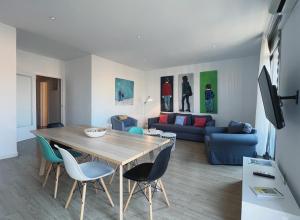 a living room with a table and a couch at Stay U-nique Apartments Casanova in Barcelona