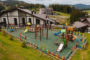 an outdoor play area with slides and slidesktop at CHALET NEBO in Bukovel