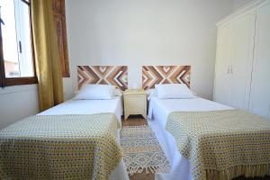 Postel nebo postele na pokoji v ubytování Casa Felisa - Vilagarcía de Arousa