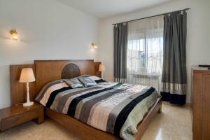 Postel nebo postele na pokoji v ubytování Vela, casa con piscina privada a pocos metros de la playa + 22 fotografií