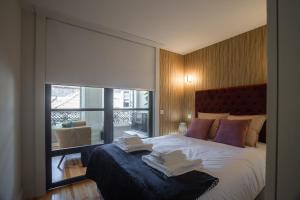 Giường trong phòng chung tại Fashion Luxury House