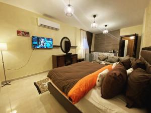 TV a/nebo společenská místnost v ubytování Anbat Midtown Hotel