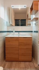a kitchen with a sink and a window at Montevecchi13 in Imola +19 photos