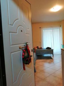 a door with a christmas wreath on it in a room at Cozy studio Maria in Paleo Faliro in Athens
