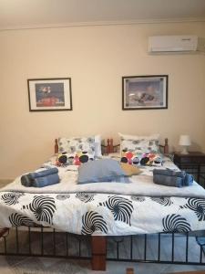 a bedroom with a large bed in a room at Cozy studio Maria in Paleo Faliro in Athens