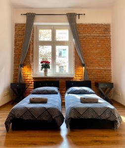 Posteľ alebo postele v izbe v ubytovaní Topolove Rooms & Apartments