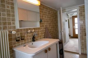 a bathroom with a sink and a mirror at Cosy Family House in Alt Sankt Johann